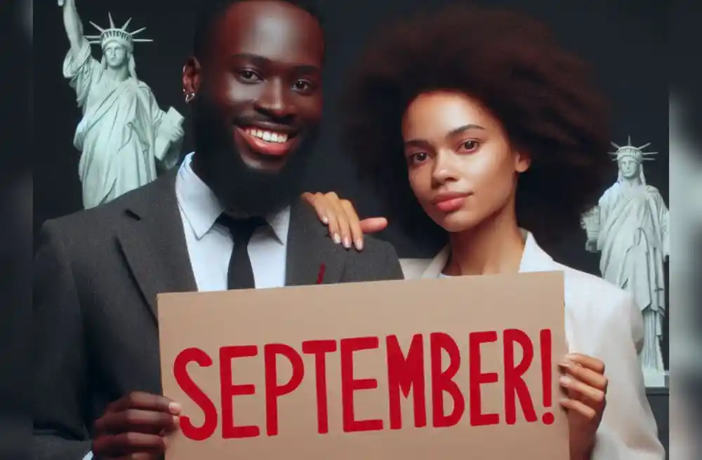 Prayerful man and woman holding up a September poster